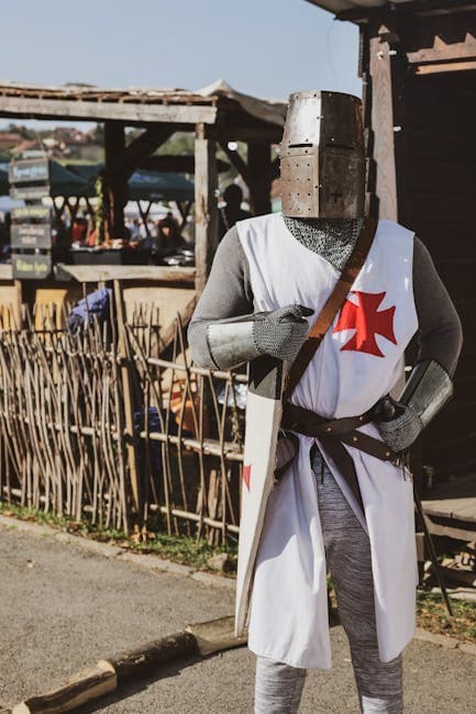 A medieval knight in full armor bearing the red cross of the Knights Templar, the military order some theorists believe may have hidden treasure on Oak Island centuries ago