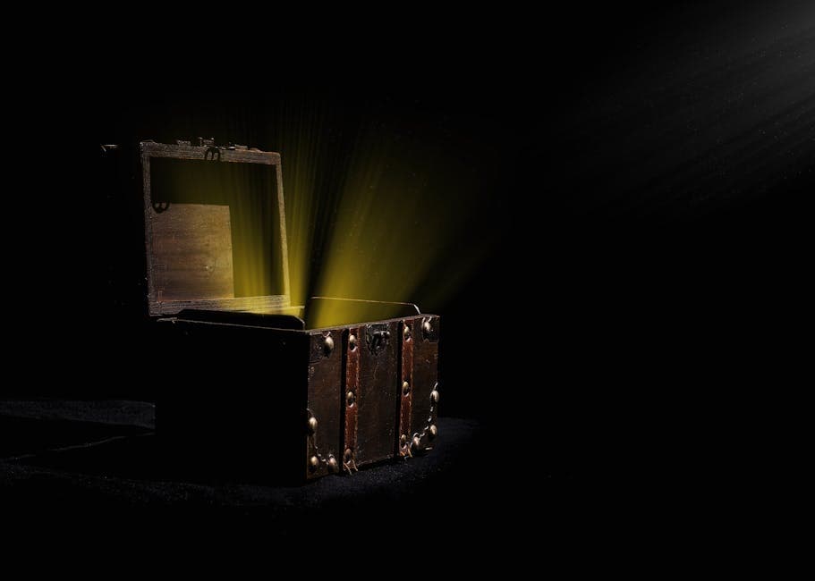 A wooden treasure chest glowing with mysterious light in a dark room, evoking the legendary treasure said to lie at the bottom of Oak Island's Money Pit