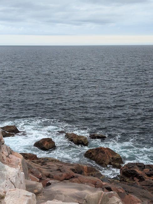 Dramatic stormy seas crashing against the rocky coast of Nova Scotia, the province where Oak Island's mystery has captivated treasure hunters for centuries