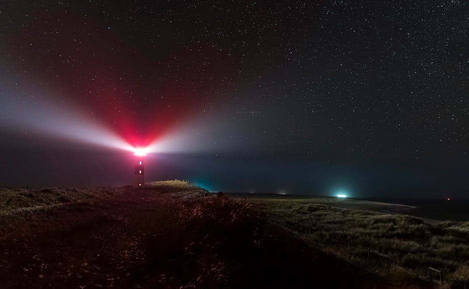 Lighthouse beam cutting through a dark night sky, similar to the Orfordness Lighthouse that Some have proposed explains the Rendlesham sightings