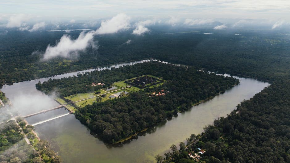Breathtaking aerial view of Angkor Wat surrounded by dense forests and a moat in Siem Reap, Cambodia