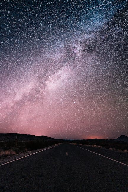 The Milky Way stretching across a desert road in Big Bend National Park, West Texas
