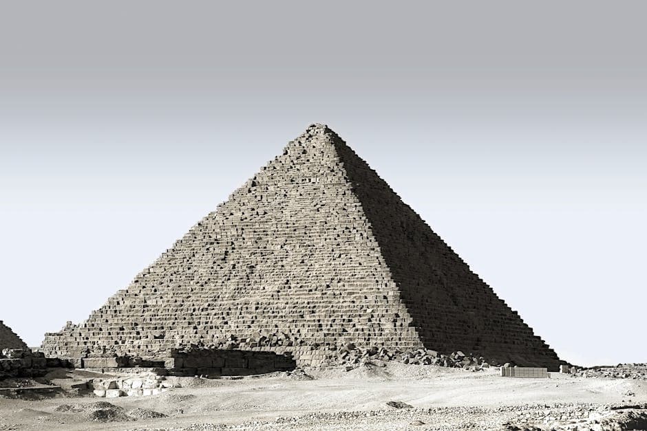 Majestic view of the Great Pyramid of Giza standing in the Egyptian desert under a clear sky