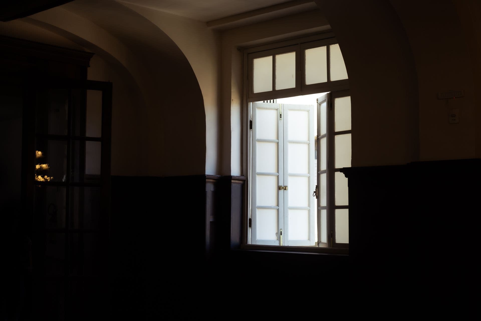 Soft daylight falling through a window into a dim, quiet room